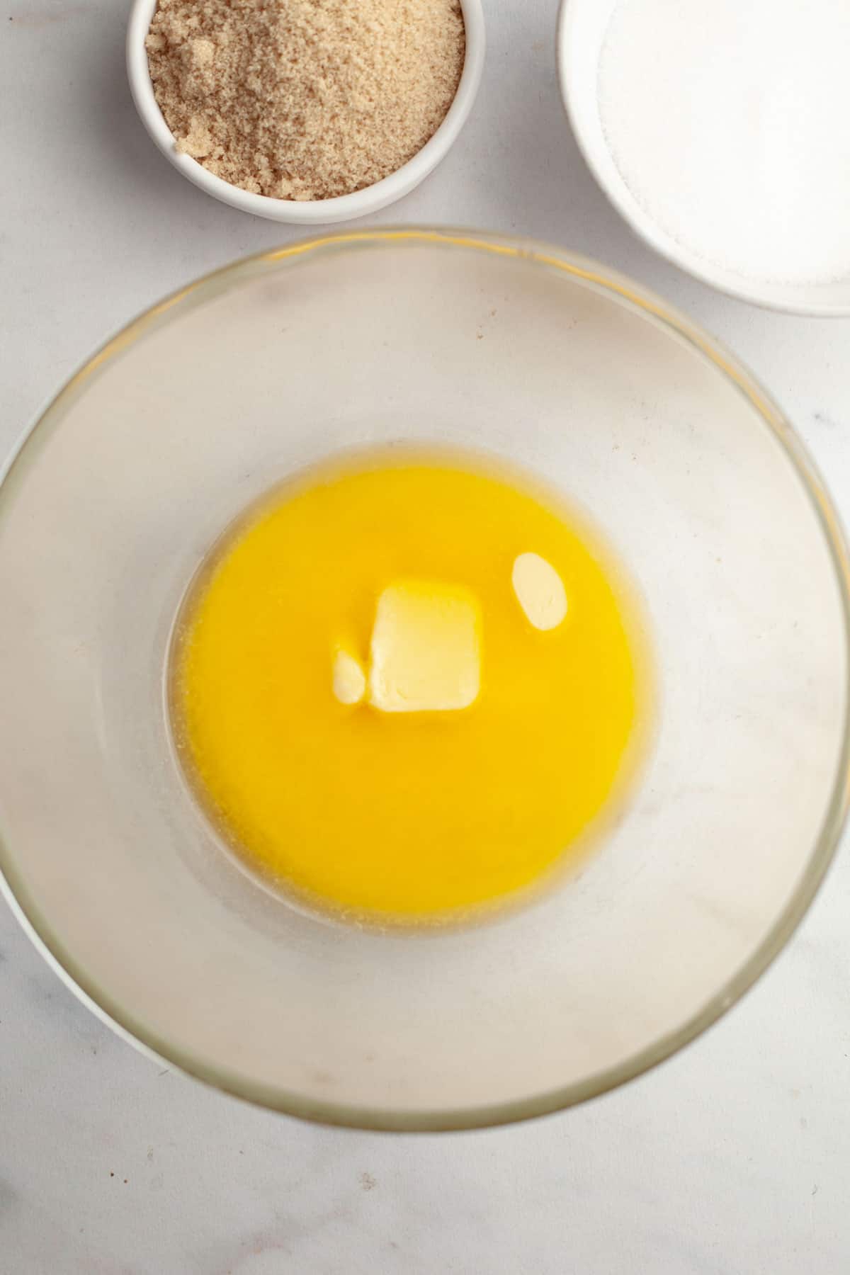 Melted butter in a glass bowl.