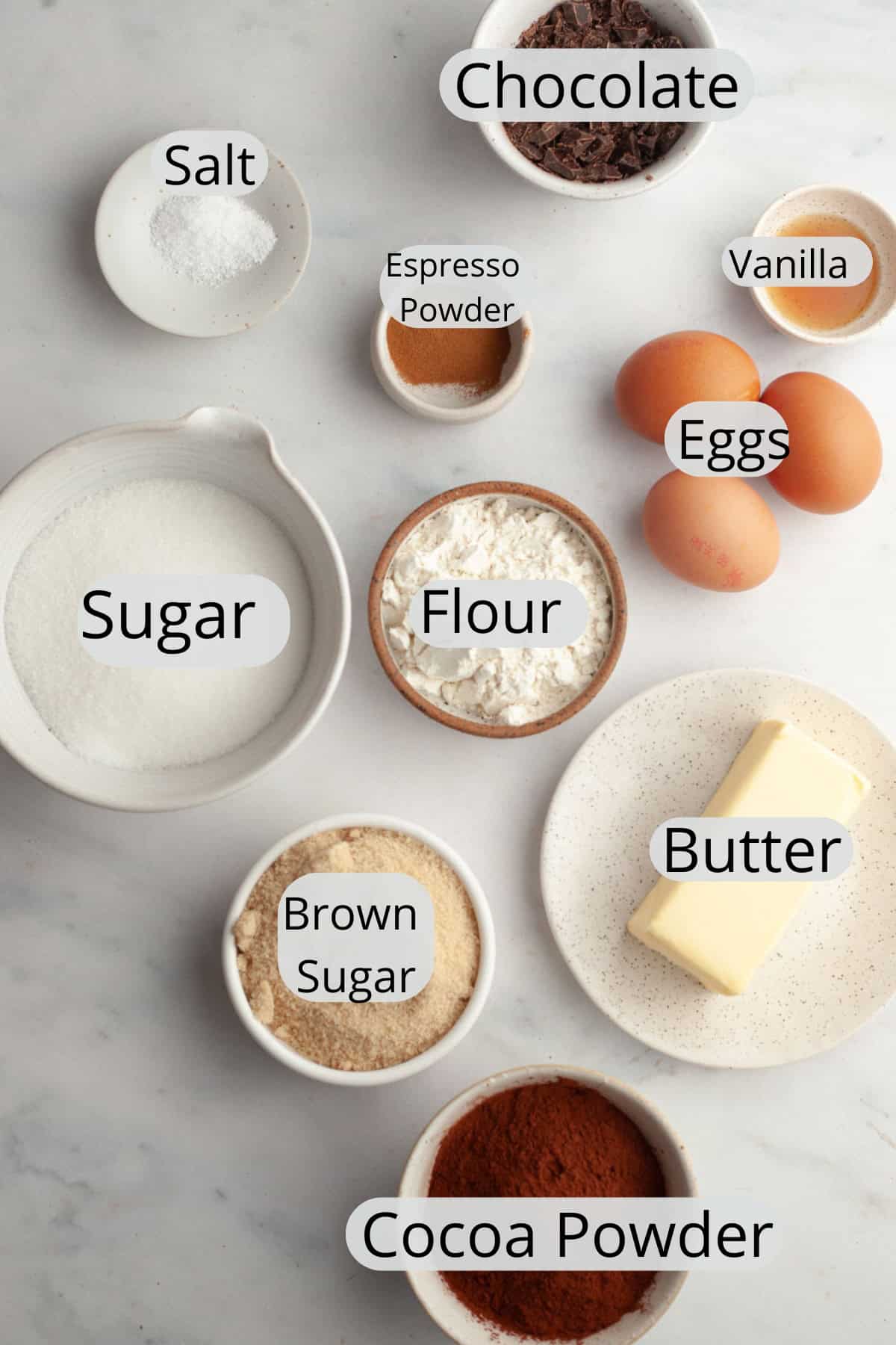 All the ingredients needed to make double fudge brownies, weighed out into bowls.