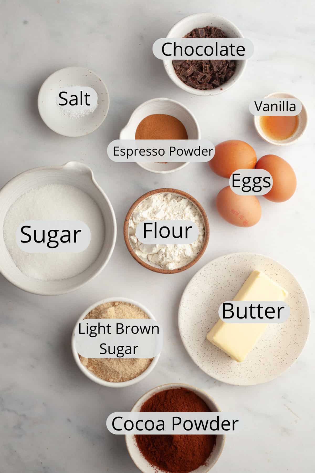 All the ingredients needed to make espresso brownies, weighed out into small bowls.