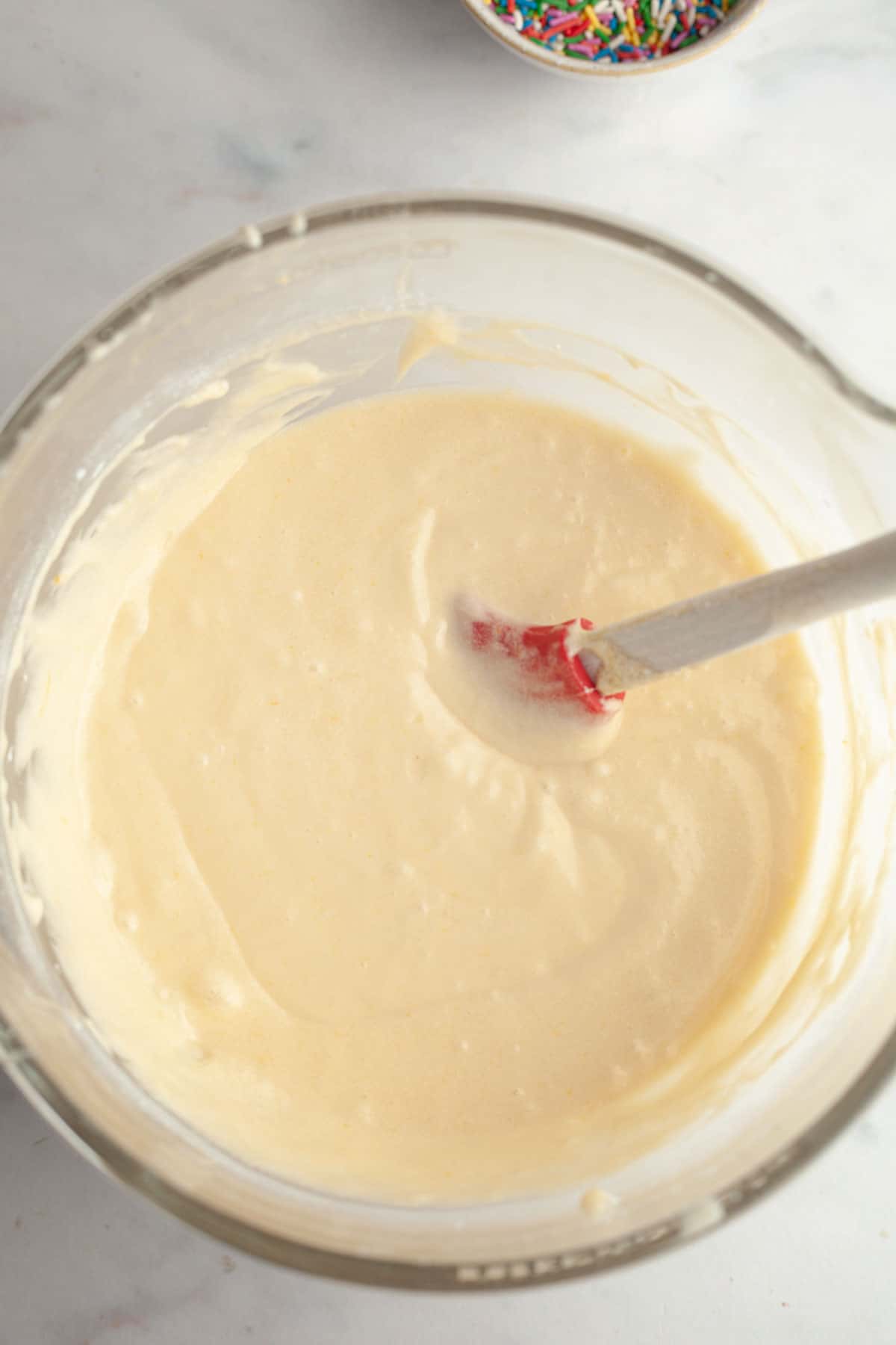 Vanilla cake batter in a large bowl.