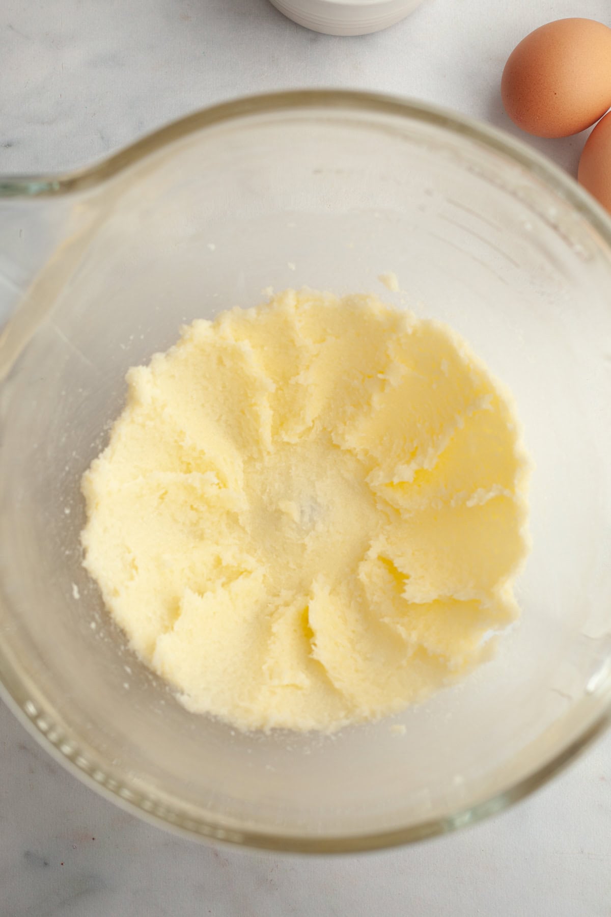 Creamed butter and sugar in a mixing bowl.