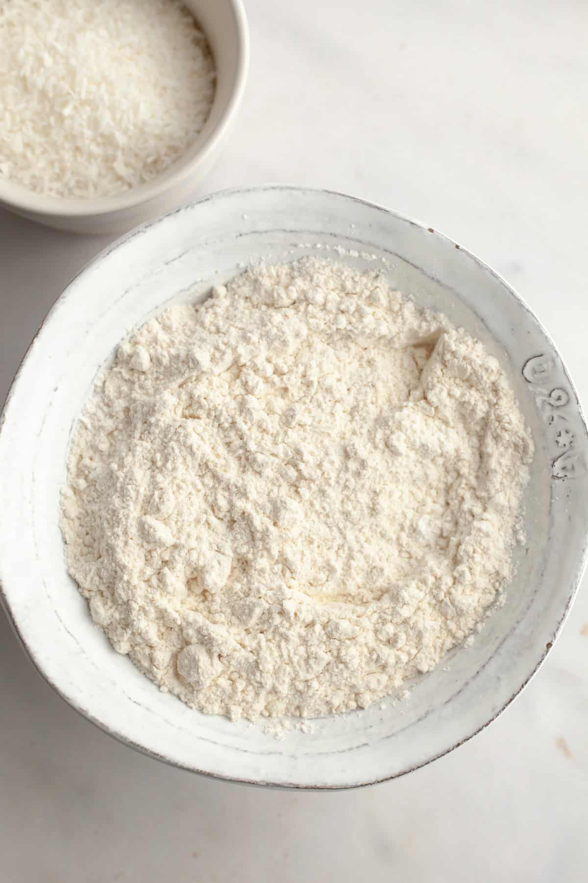 Flour in a small white bowl.