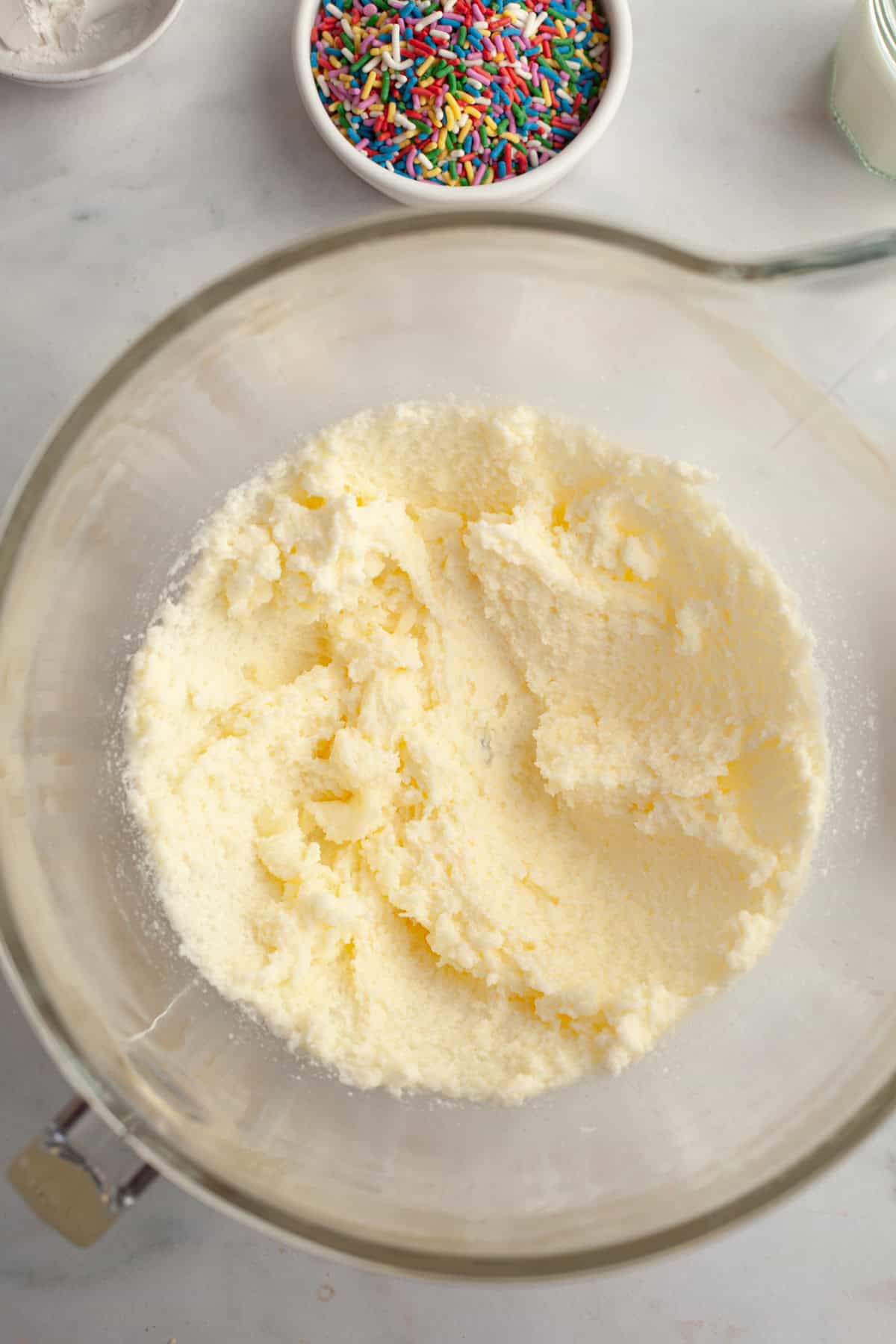 Creamed butter, oil, and sugar in a mixing bowl.