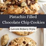 Pistachio cream filled chocolate chip cookies, broken in half to show the filling inside. One cookie is on a baking sheet and not broken.