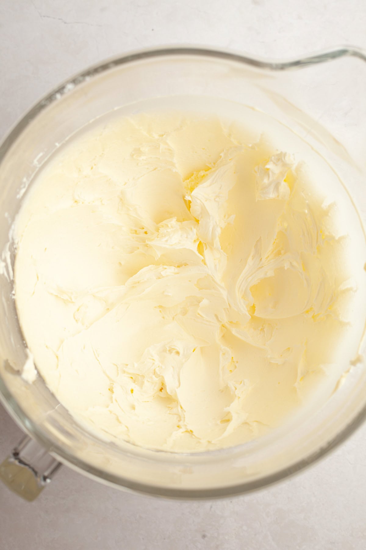 Vanilla bean buttercream in a large glass bowl.