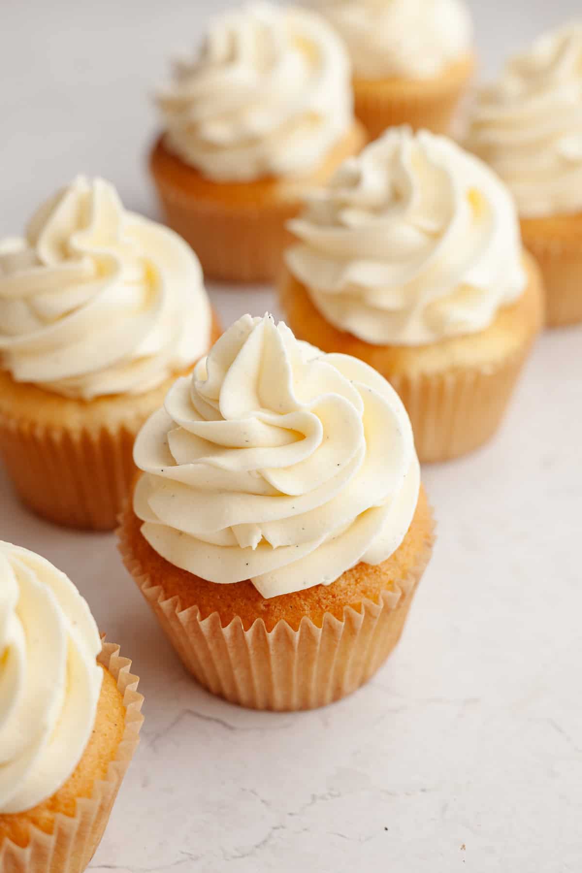Cupcakes frosted with vanilla bean buttercream.