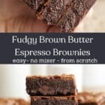 A hand holding a stack of four brown butter brownies, and that stack on parchment paper.