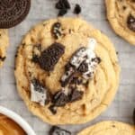 A close up of an Oreo peanut butter cookie on parchment paper.