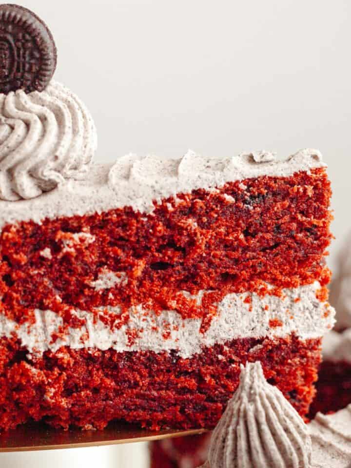 A close up of a slice of Oreo red velvet cake.