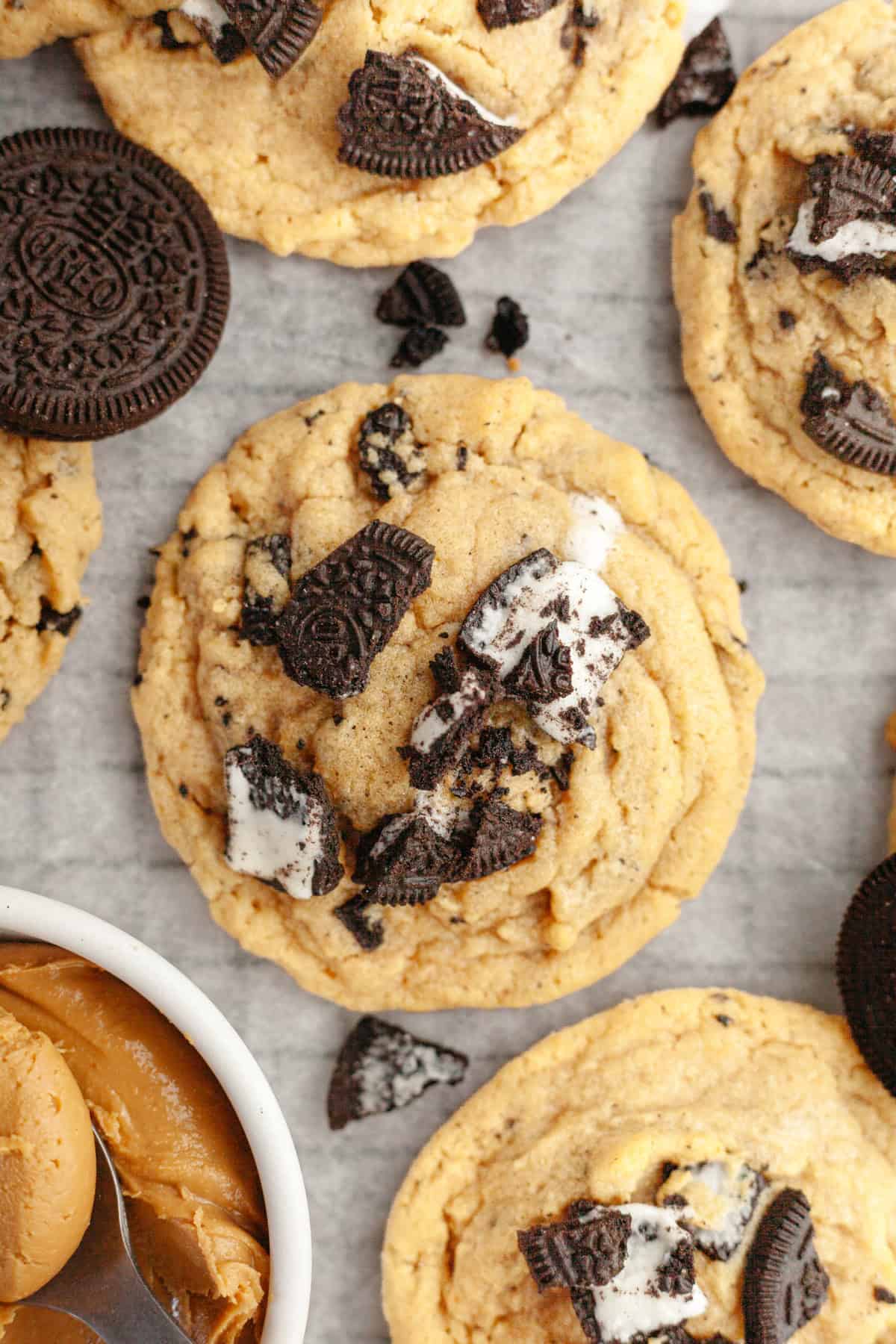 A close up of Oreo peanut butter cookies on parchment paper.