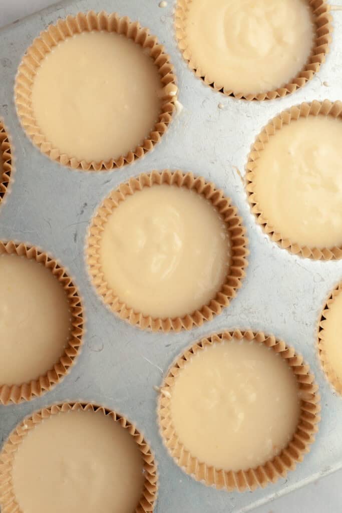 Unbaked vanilla cupcakes.