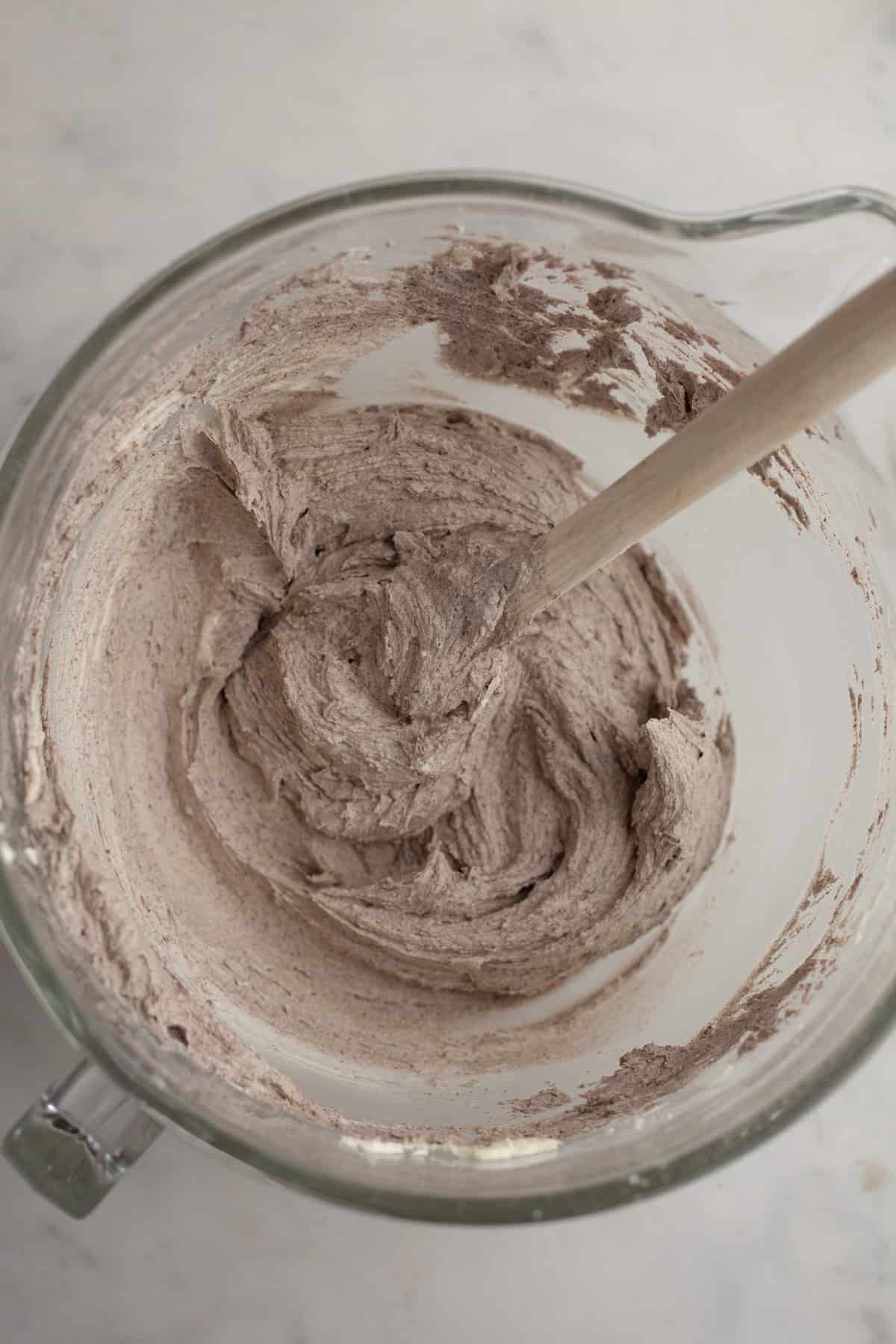 Oreo frosting in a glass bowl.