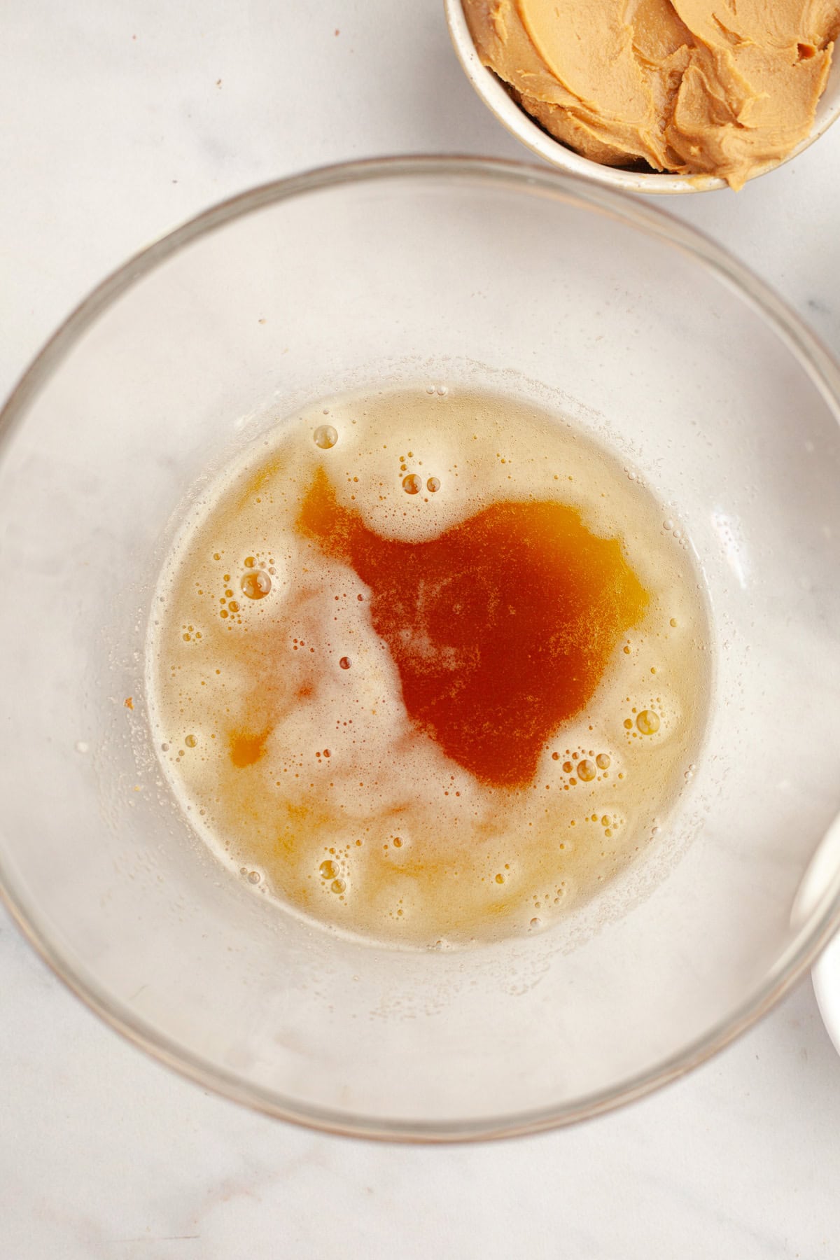 Brown butter in a glass bowl.