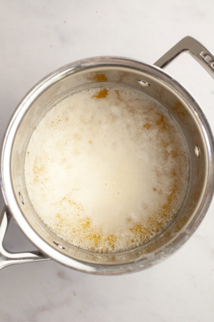 Foaming butter in a saucepan.