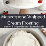 A cake covered in a mascarpone whipped cream frosting and decorated with fresh berries, and a small grey bowl with frosting in it.