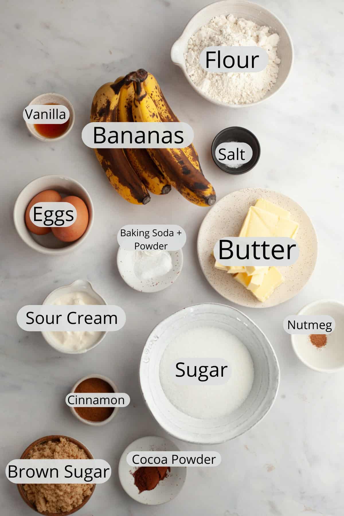 All the ingredients needed to make banana coffee cake, weighed out into small bowls.