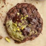 A close up of a chocolate pistachio cookie.