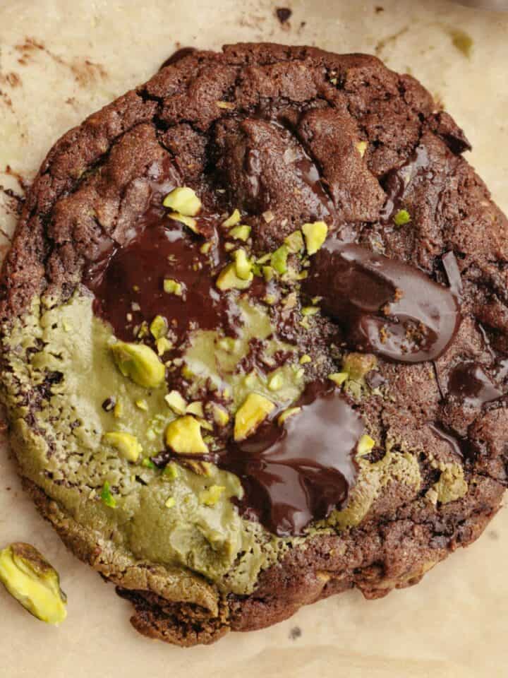 A close up of a chocolate pistachio cookie.