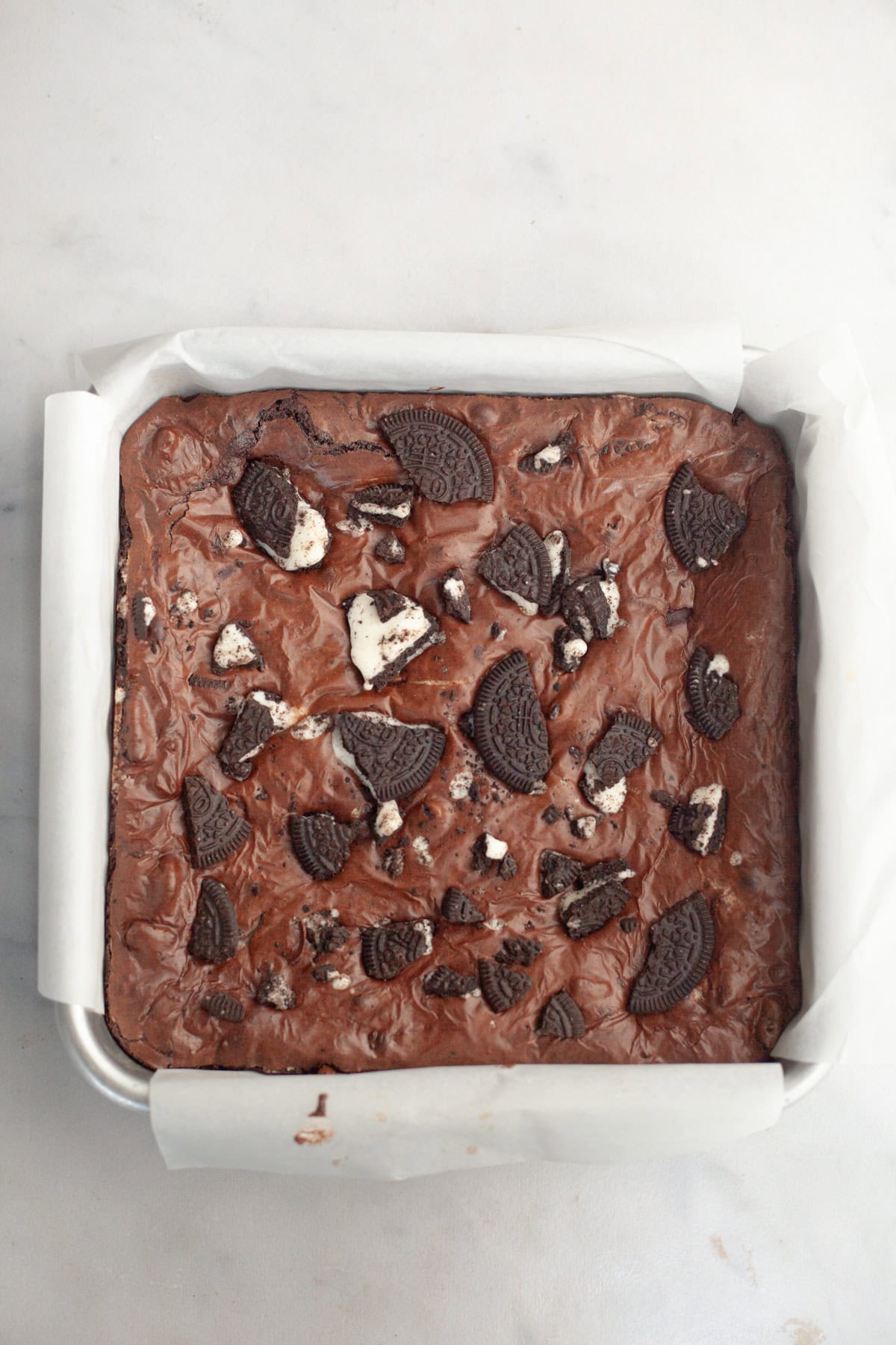 Baked Oreo brownies in a square baking pan.