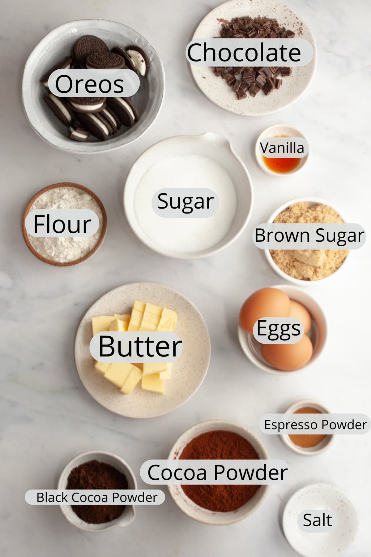 All the ingredients needed to make Oreo brownies, weighed out into small bowls.