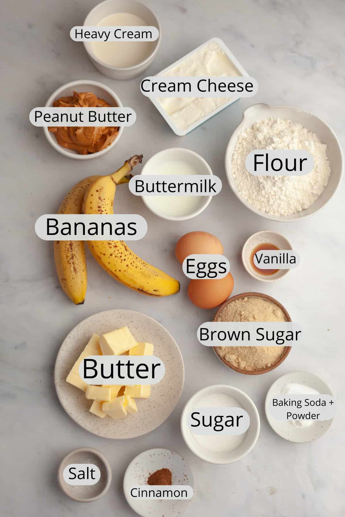 All the ingredients needed to make a banana peanut butter cake, weighed out into small bowls.