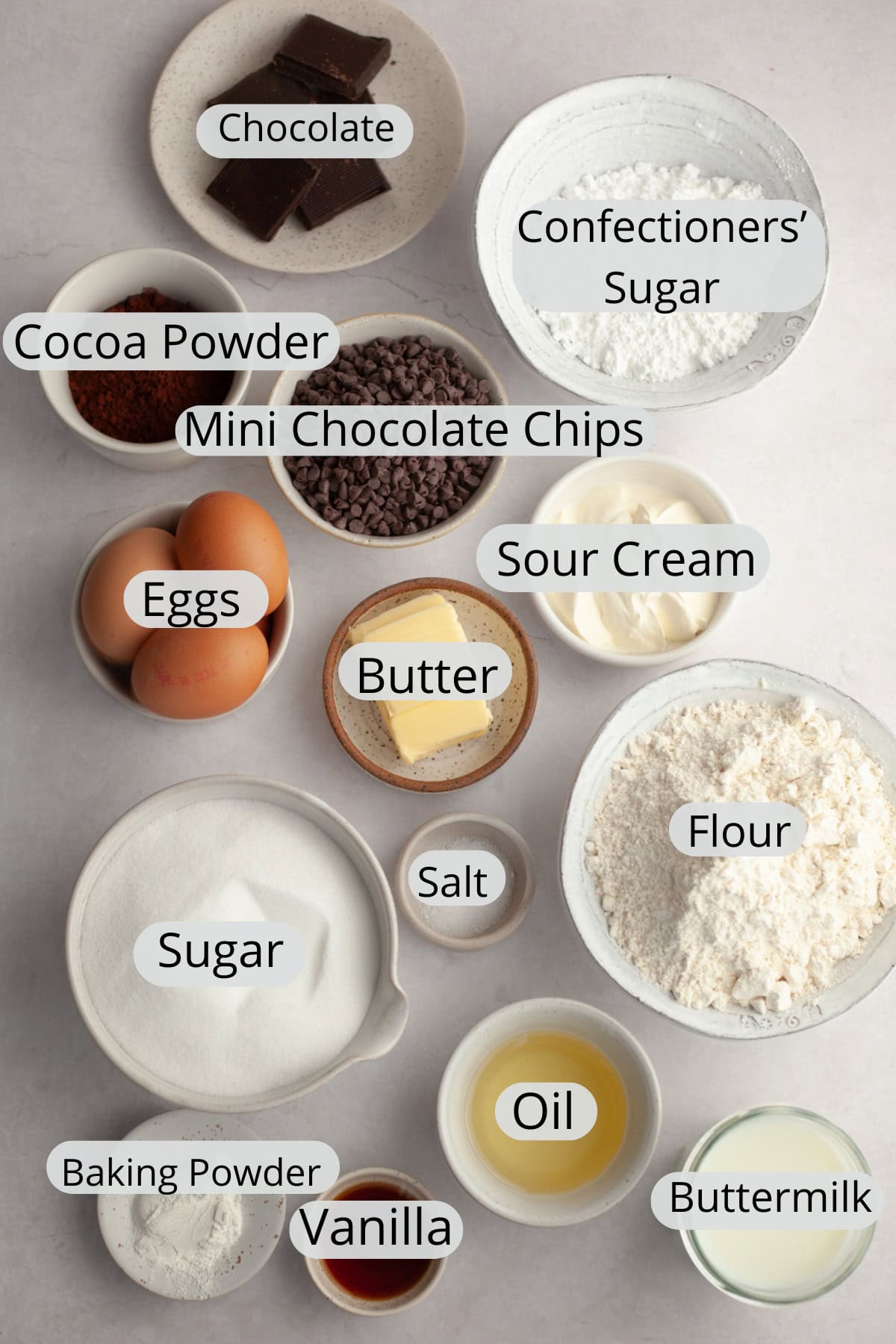 All the ingredients needed to make a chocolate chip sheet cake with chocolate frosting.