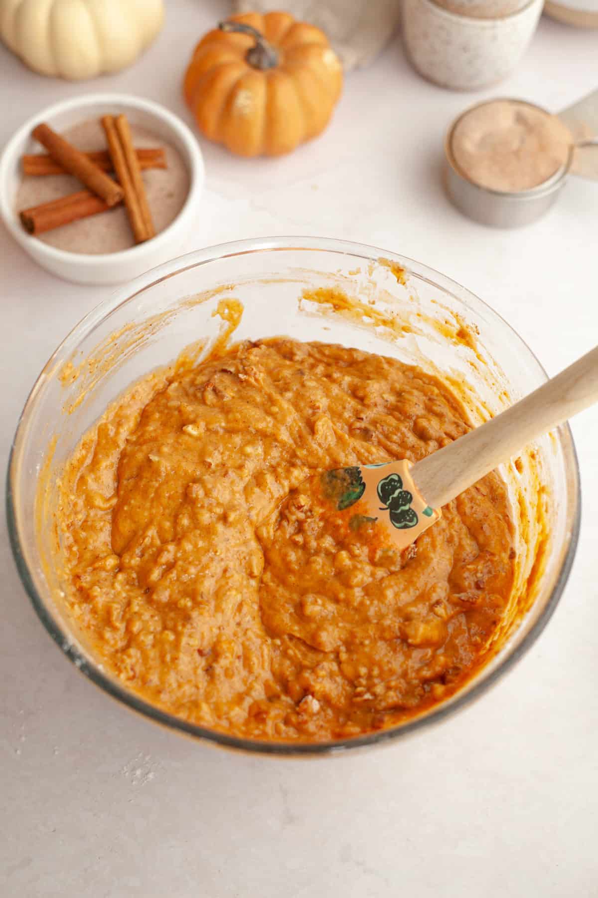 Pumpkin pecan muffin batter in a bowl.