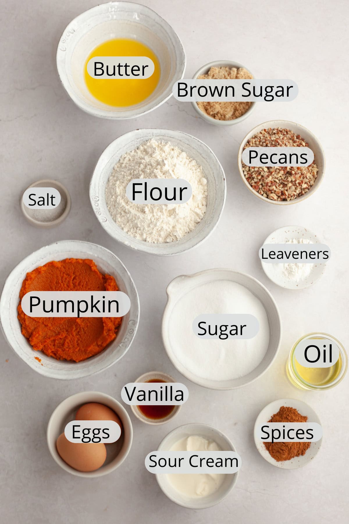 All the ingredients needed to make pecan pumpkin muffins with streusel.
