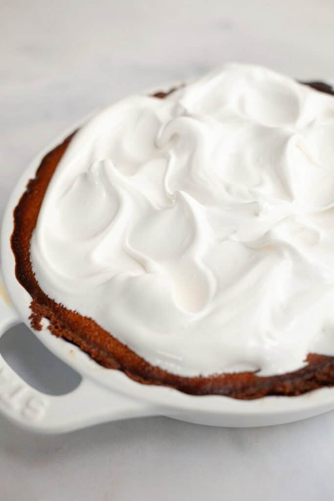 A pumpkin pie covered in marshmallow meringue.