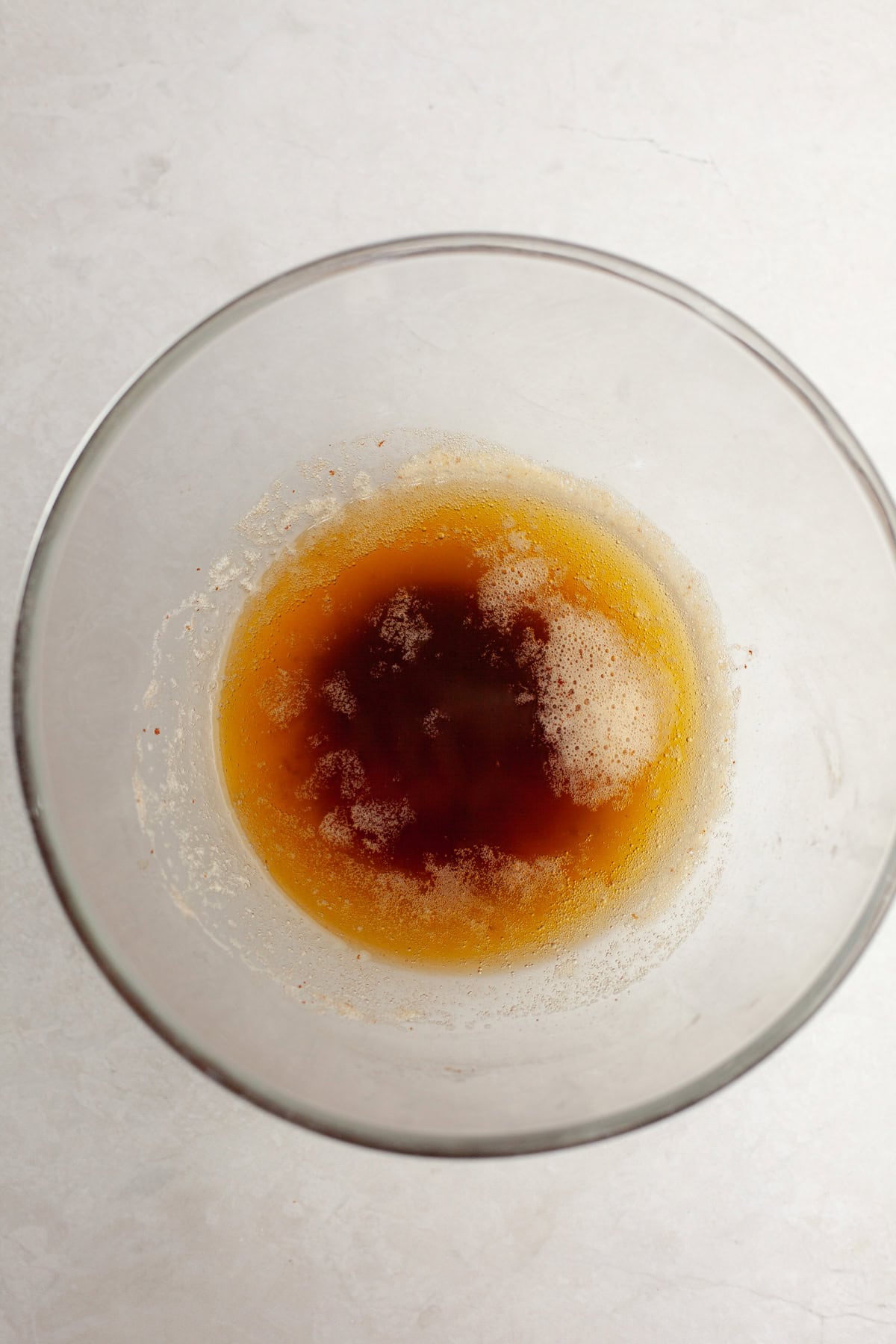 Brown butter in a glass bowl.