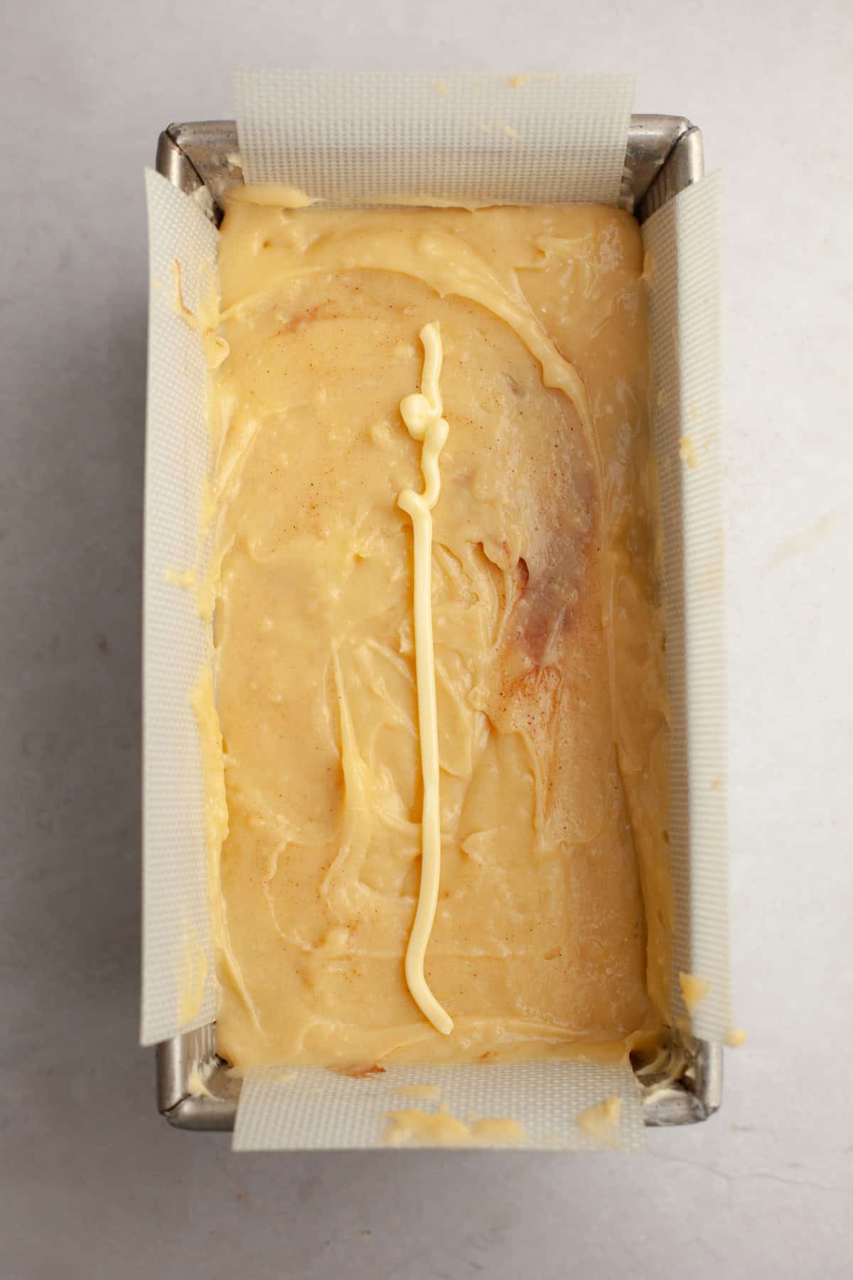 A pound cake in a loaf pan, unbaked.