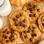 Brown butter pumpkin chocolate chip cookies on brown parchment paper.