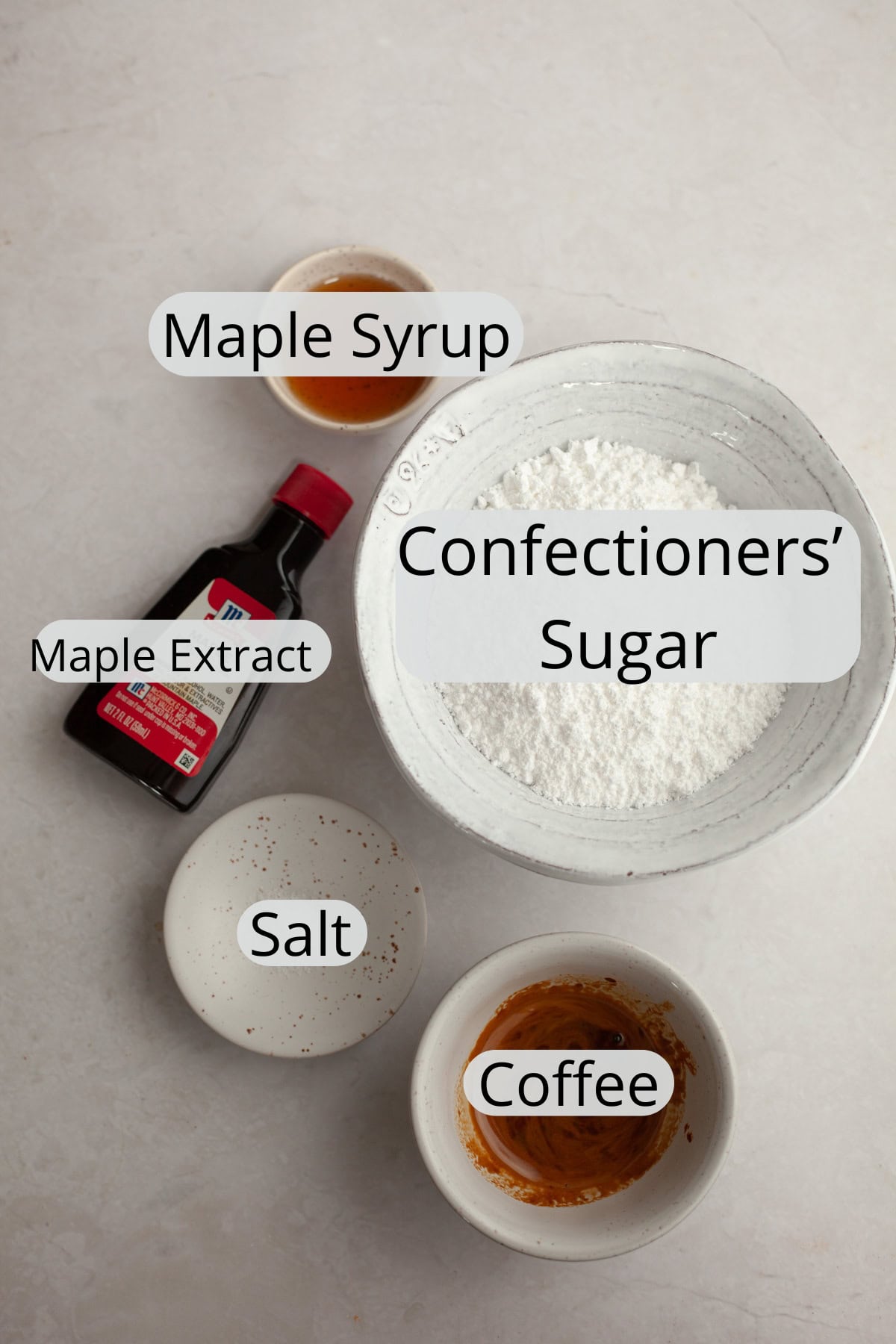 All the ingredients needed to make a maple espresso glaze, weighed out into small bowls.