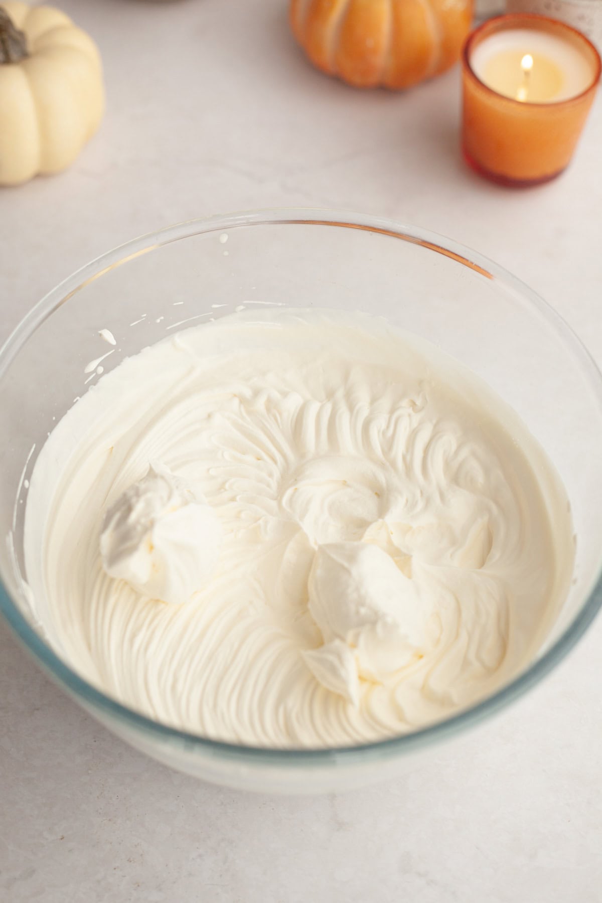 Whipped cream in a glass bowl.