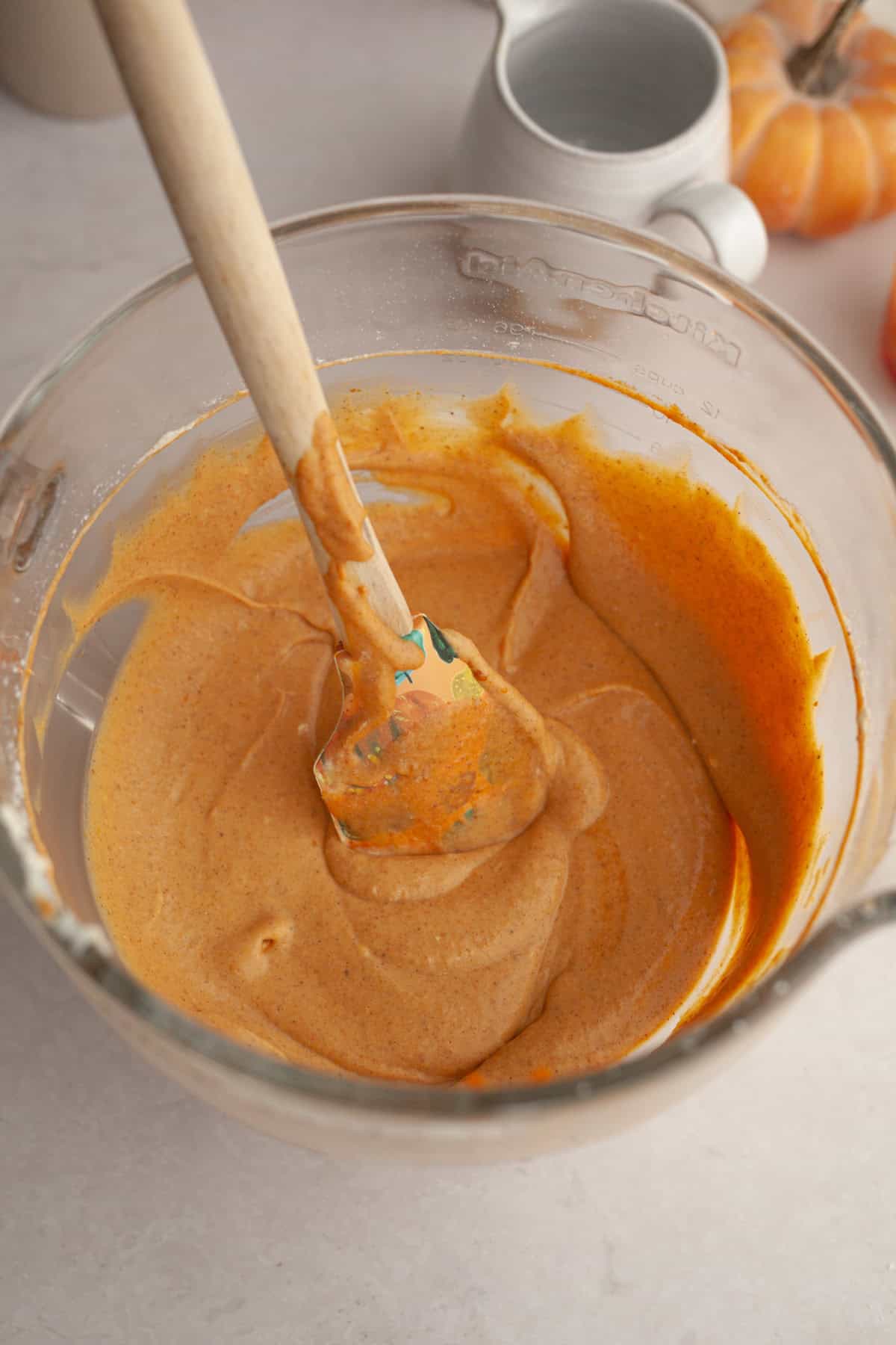 Pumpkin cheesecake filling in a large bowl.