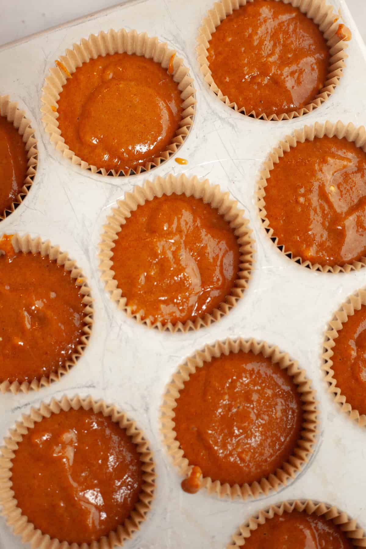 Unbaked pumpkin cupcakes.