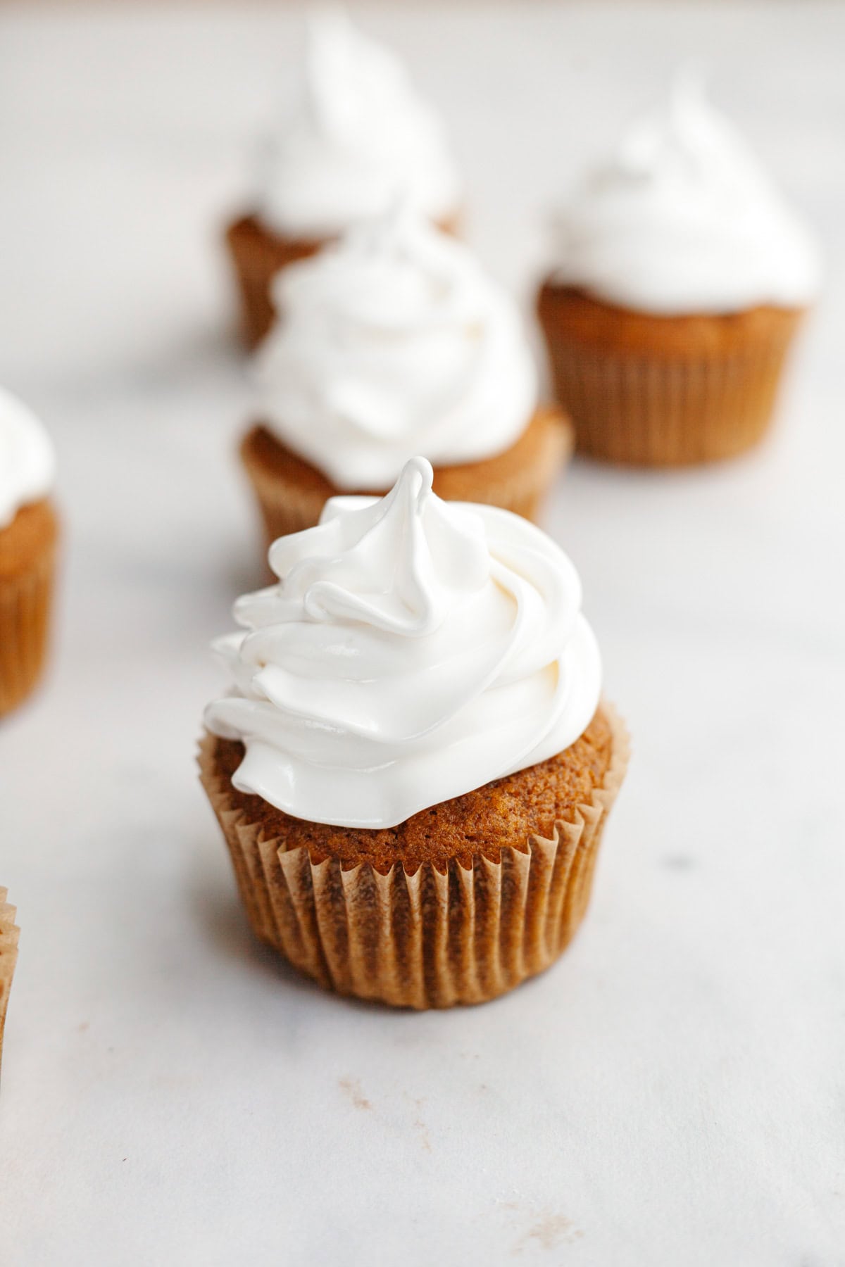 Frosted pumpkin cupcakes.