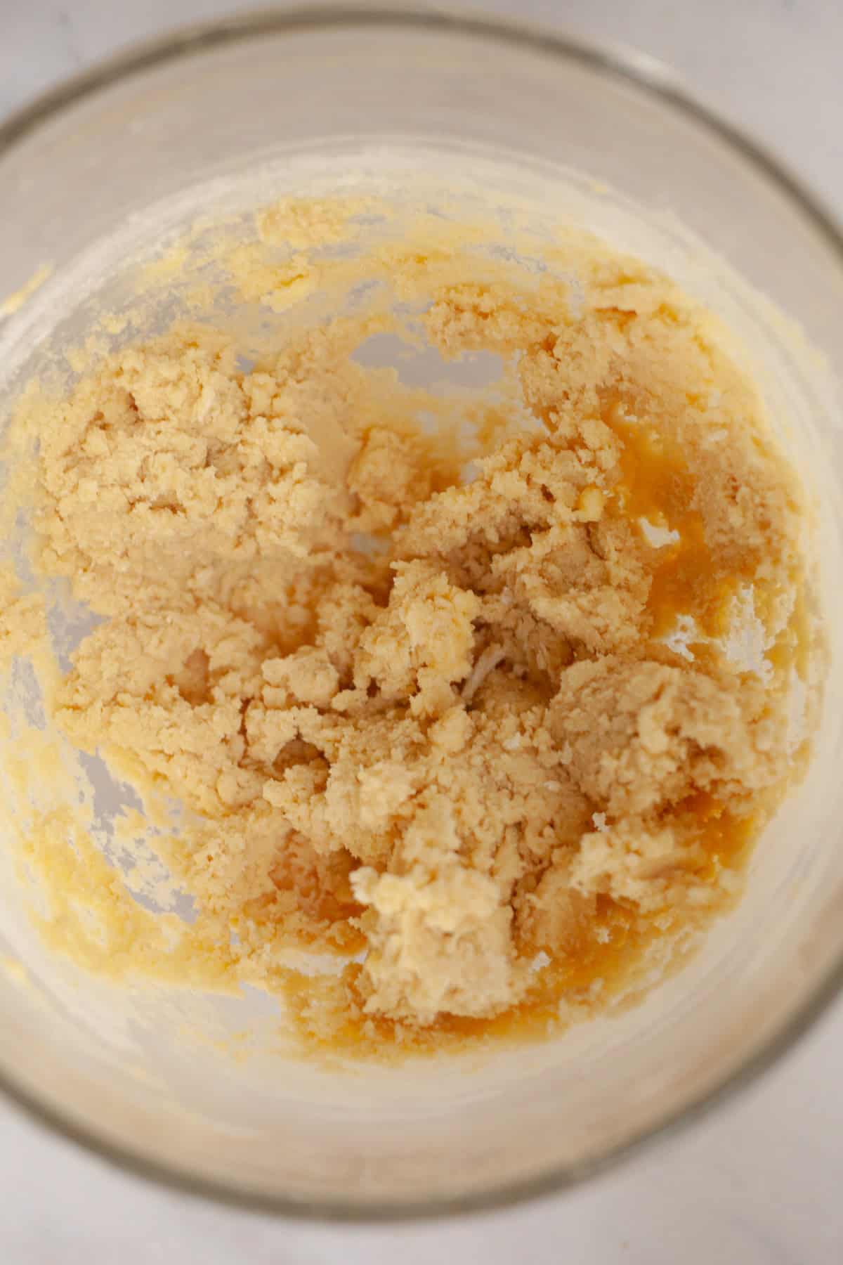 Shortbread cookie dough in a glass bowl.