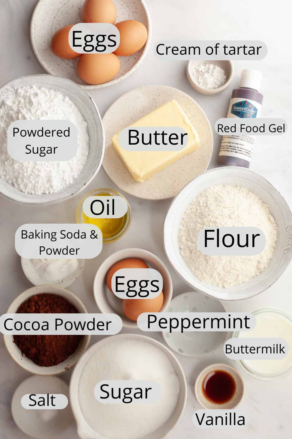 All the ingredients needed to make peppermint bark cake, weighed out into small bowls.