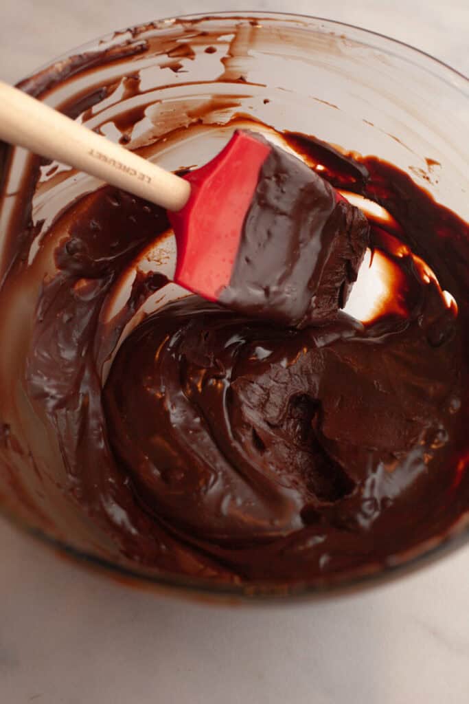 A glass bowl with chocolate ganache.