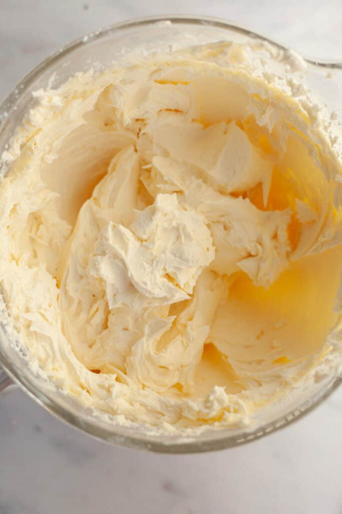 White frosting in a glass bowl.