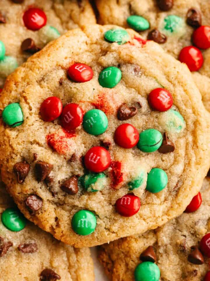 A close up of red and green Christmas chocolate chip cookies.