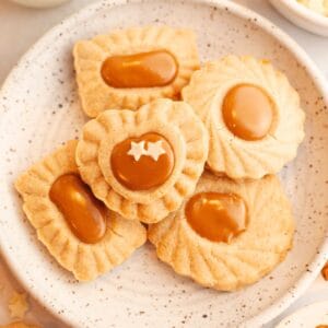 A small plate with cinnamon shortbread cookies that have a Biscoff middle.