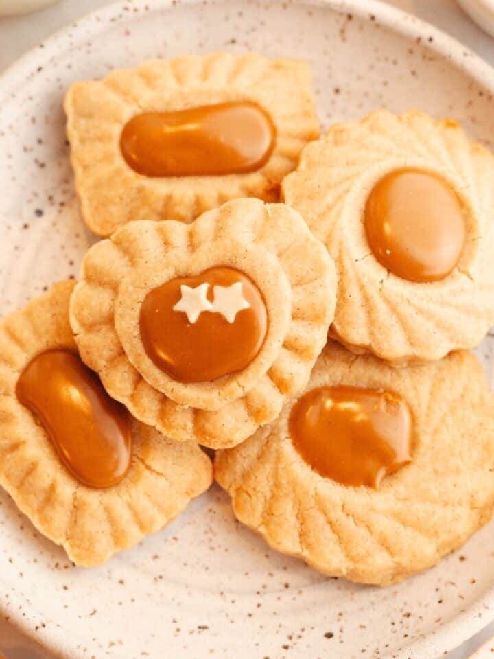 A small plate with cinnamon shortbread cookies that have a Biscoff middle.
