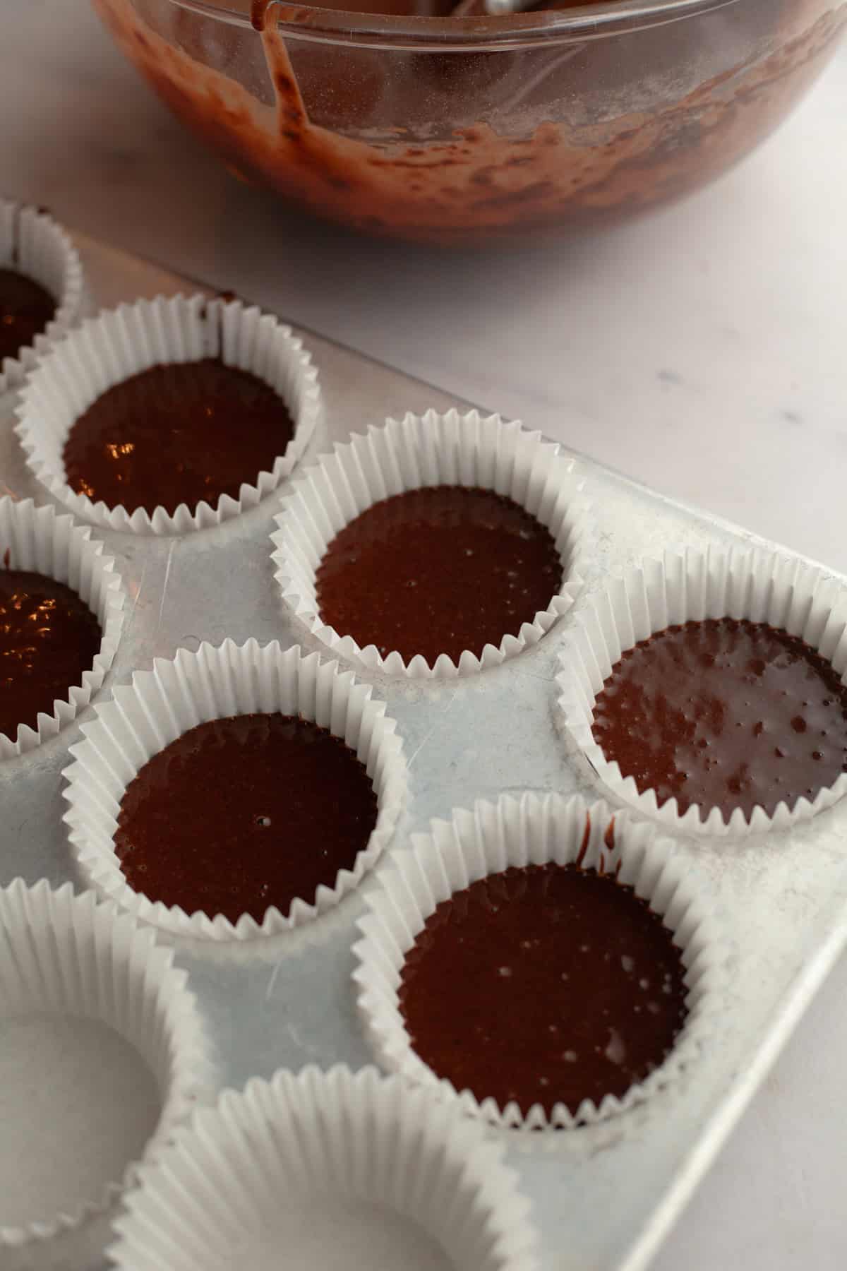 Unbaked chocolate cupcakes.