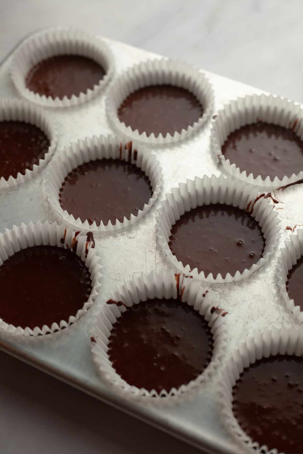 Unbaked chocolate cupcakes.