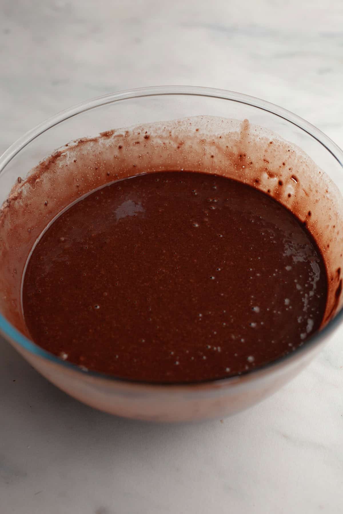 Chocolate cake batter in a bowl.