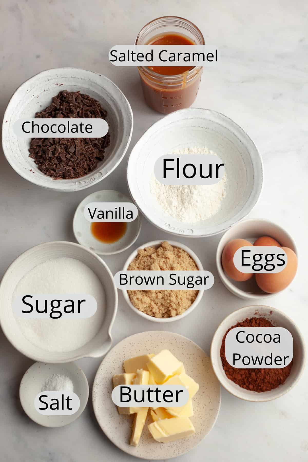 All the ingredients needed to make salted caramel brownies, weighed out into small bowls.