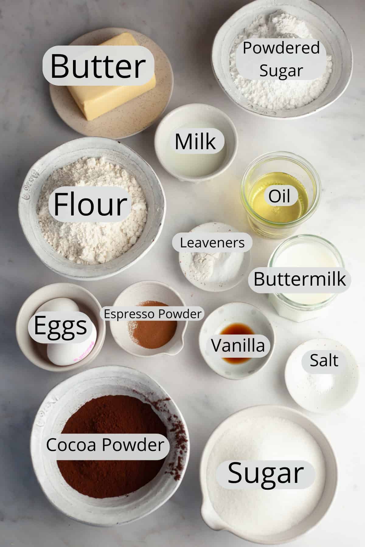 All the ingredients needed to make a chocolate sheet cake with vanilla frosting.