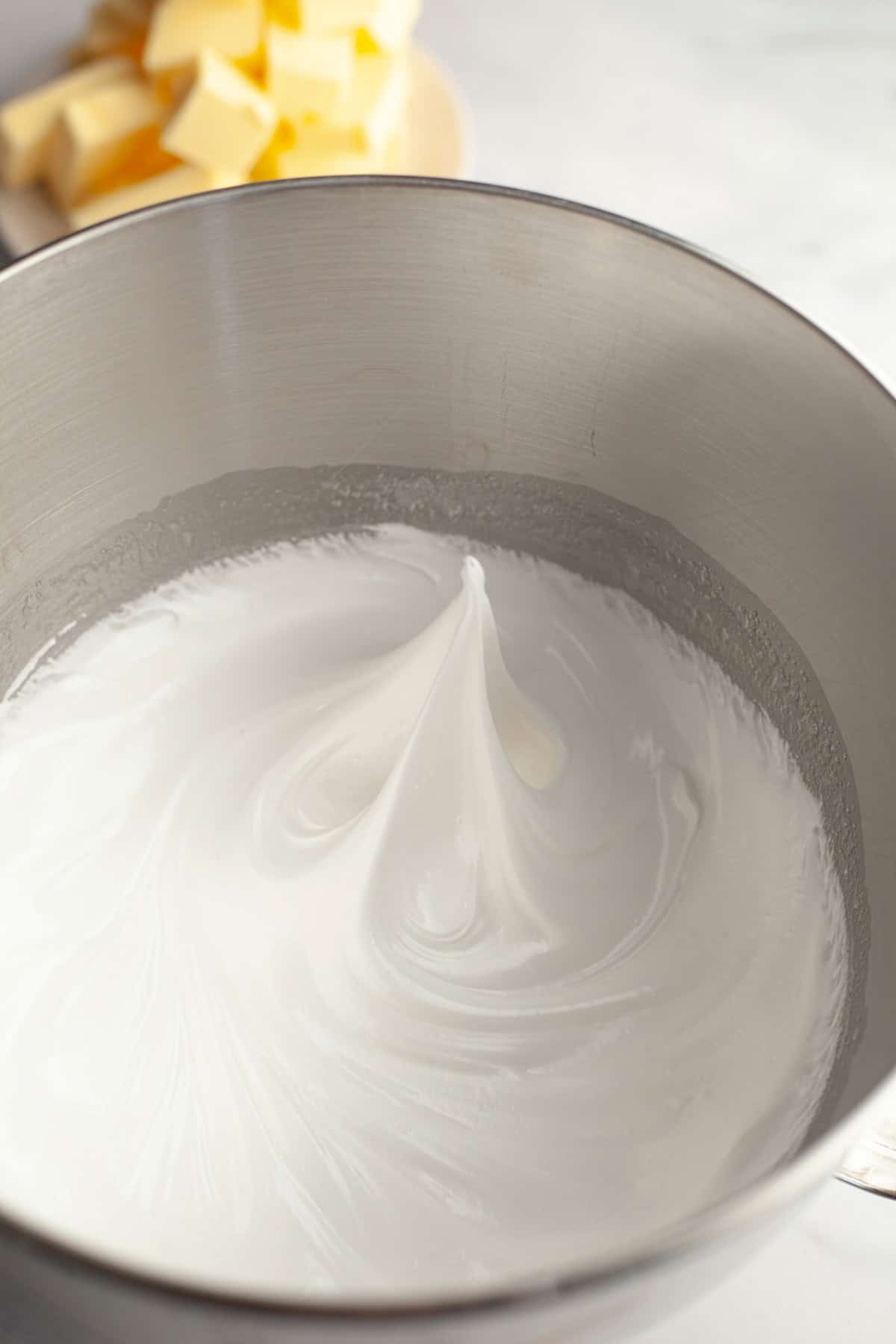 Meringue in a metal bowl.